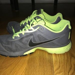 Gray and lime green Nike’s